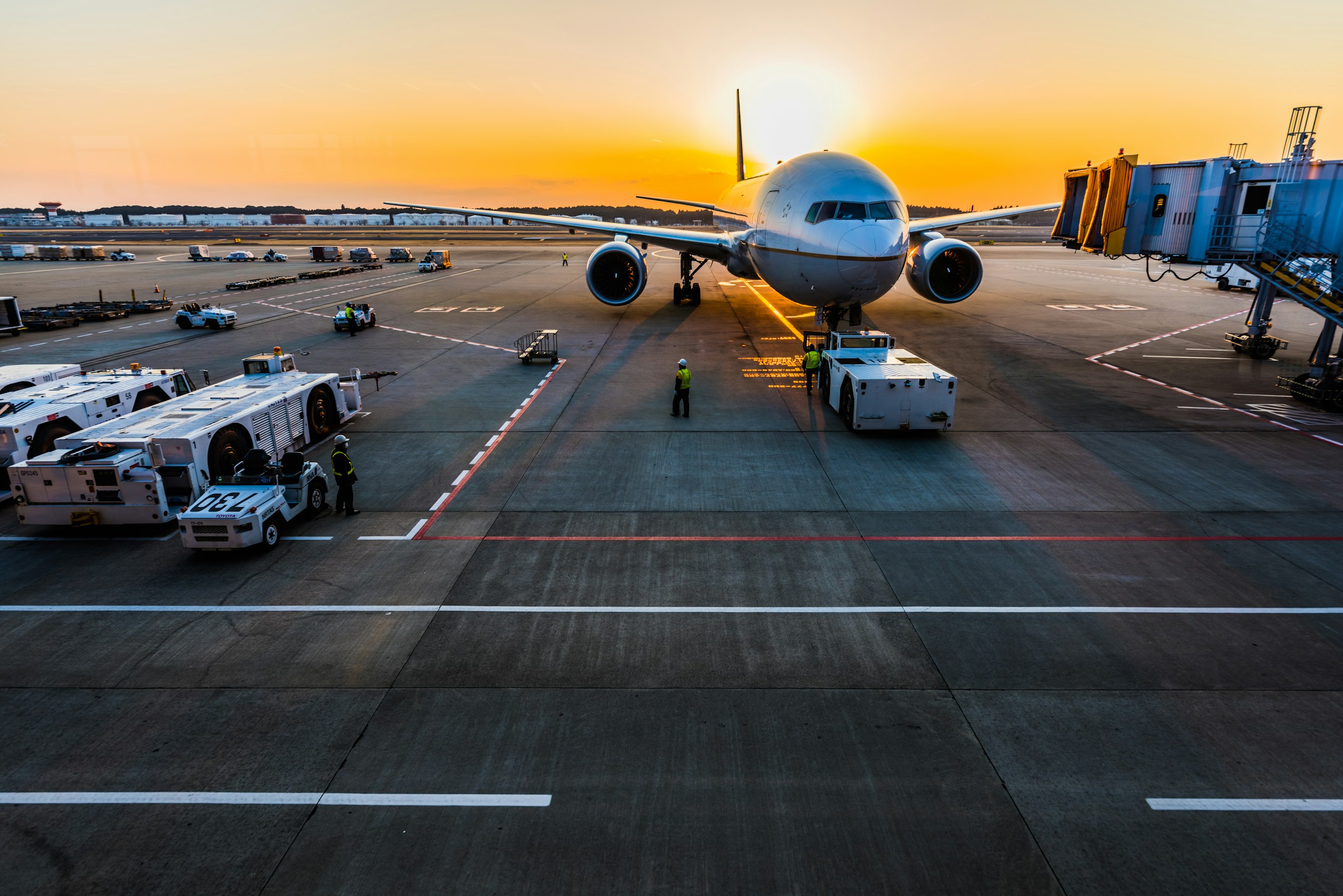 Passengers at the airport with luggage preparing for a flight